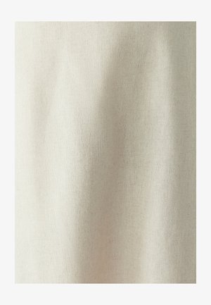 Light beige fabric with a subtle texture and even weave, showing soft creases and folds, suitable for various textile applications.