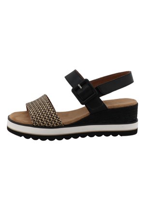 Sandale compensée pour femme avec bride noire à la cheville et boucle, bride avant tissée beige, semelle intérieure rembourrée couleur cuir tanné et semelle noire à bande blanche.