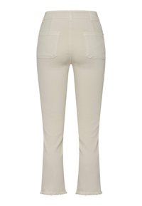 Beige flared pants with a smooth texture, featuring two back pockets and frayed hems. The design is simple and tailored.