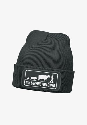 Black knitted beanie with a folded cuff, featuring a white graphic design of a farmer with animals and text "ICH & MEINE FOLLOWER" in a rectangular patch.