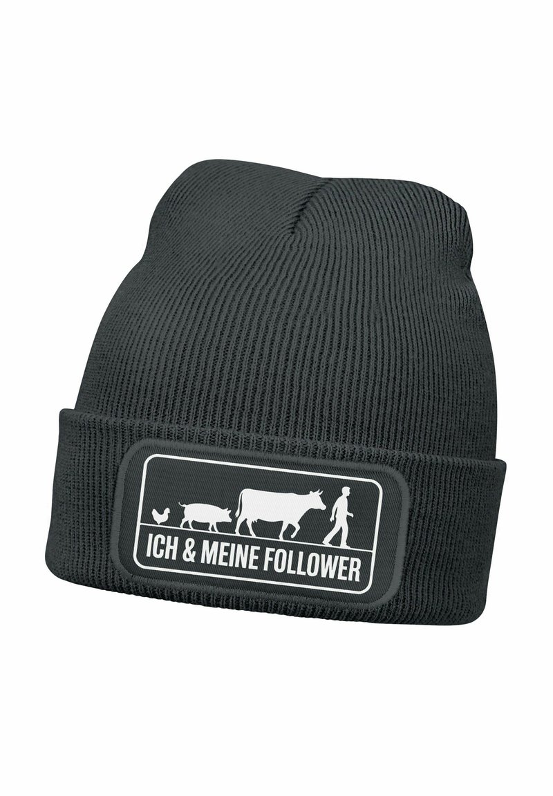 Black knitted beanie with a folded cuff, featuring a white graphic design of a farmer with animals and text "ICH & MEINE FOLLOWER" in a rectangular patch.