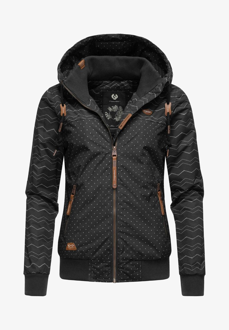 Veste noire avec un motif à pois et un design en zigzag. Comprend une capuche, une fermeture éclair à l'avant et des accents en cuir marron. Manches à poignets élastiques.