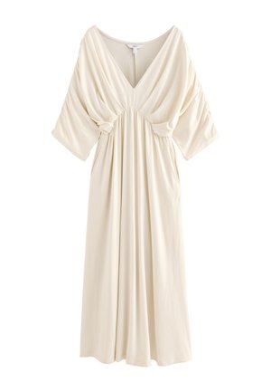 Długa sukienka w kolorze kremowym z dekoltem w serek, marszczoną piersią, luźnymi rękawami typu nietoperz i płynną plisowaną spódnicą.