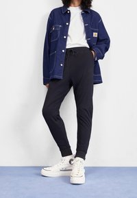 Nike Sportswear Träningsbyxor - black