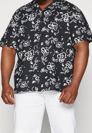 Zwart shirt met korte mouwen en een abstract wit bloemenpatroon, met een knoopsluiting en een relaxte pasvorm.