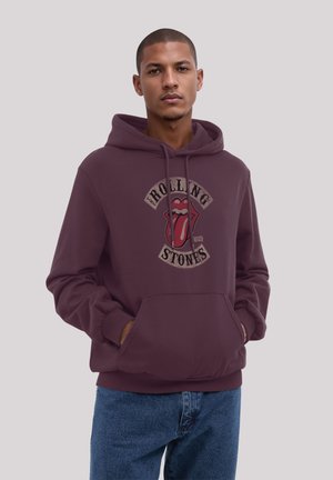 Burgundy hoodie with a front pocket and drawstring hood, featuring a graphic of the Rolling Stones lips and text, made from soft fabric.