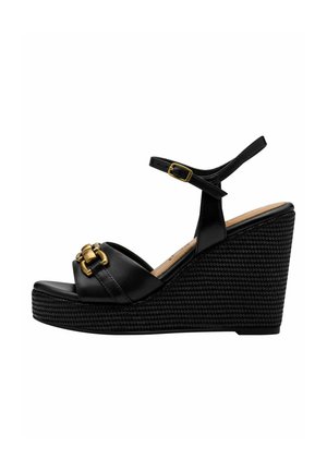 Black wedge sandal with a textured platform, smooth leather upper, dual straps, and gold hardware accent. Adjustable ankle strap included.