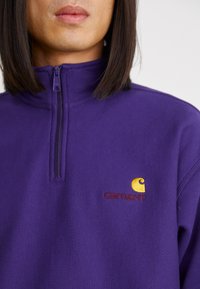 Carhartt WIP HALF ZIP AMERICAN SCRIPT - Sweatshirt - aura