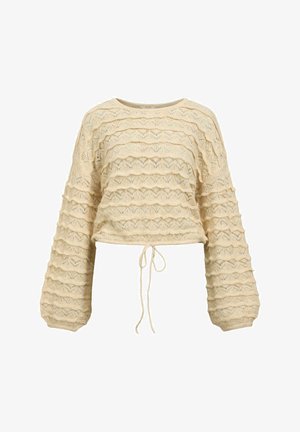 Pull en tricot de couleur crème avec des motifs horizontaux en forme de vagues, des manches longues et bouffantes, et un cordon de serrage noué à la taille.