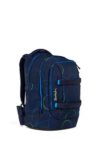 Navy blue backpack with geometric green and blue patterns, two main compartments, padded straps, and the brand name "Satch" on the front pocket.