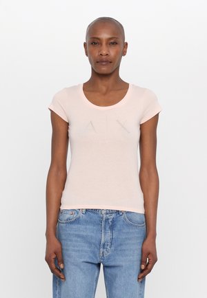 Light pink fitted t-shirt with short sleeves, round neckline, and crystal embellishments featuring the letters "AIX" on the front.