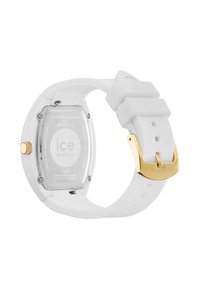 Bela silikonska ura s pravokotnim srebrnim ohišjem. Zlata oprema na sponki. Na zadnji strani je vgravirano "ice watch" in ostali podrobnosti.