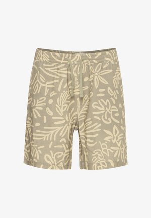 Valged beežid lühikesed püksid, millel on suur, abstraktne oliivroheline lehemuster, elastne vöökoht paelaga ja lõdvestunud lõige.