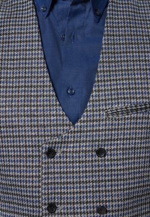 Dwurzędowa kamizelka w wzór houndstooth, z szaro-czarnymi i niebieskimi tonami. Teksturowana tkanina z czarnymi guzikami i niebieską koszulą pod spodem.