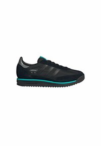 Black Adidas SL 72 sneakers with a texture combination of suede and mesh, featuring three black stripes, turquoise accents, and a rubber sole.