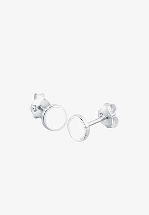 Boucles d'oreilles en argent avec un design de monture ronde, présentant une texture lisse et un centre clair, marquées "925" pour l'argent sterling.