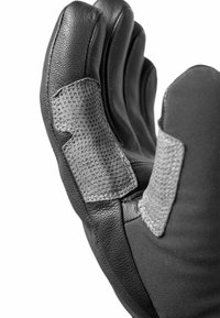 Schwarze Lederhandschuhe mit strukturierten grauen Akzenten und digitalen Griffüberzügen auf den Fingern, die ein enges Design und genähte Nähte präsentieren.
