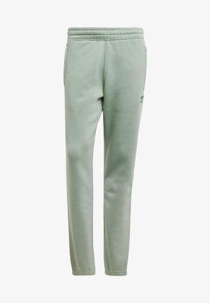 Pantalons de survêtement vert clair en tissu doux avec une taille élastique. Comprend des poches latérales et un petit logo vert sur la cuisse gauche.