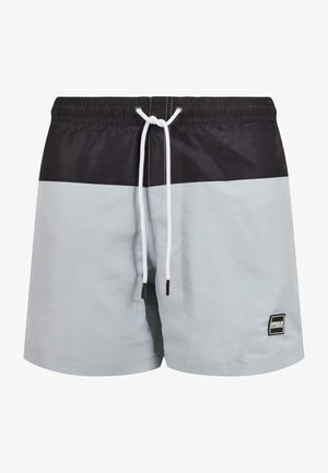 Costumi da bagno da uomo in grigio chiaro e design a blocchi di colore nero. Realizzati in materiale leggero, presentano un elastico in vita con cordino bianco.