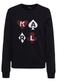Svart sweatshirt med pluffiga broderade motiv av spelkort i röd och vit, med rund halsringning och ribbade muddar och nederkant.