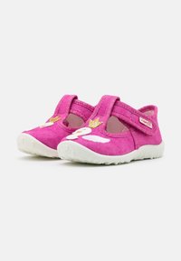 Pink fabric shoes with white rubber soles, featuring a crown and swan design on the front and elastic straps for easy wear.