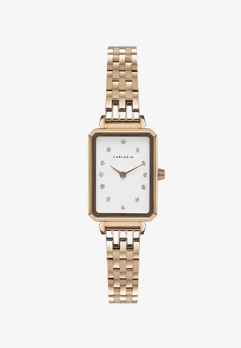 Montre rectangulaire dorée avec un cadran blanc, des marqueurs d'heure en diamant, et un bracelet en maillons métalliques. Équipée d'une lunette noire et du nom de la marque.