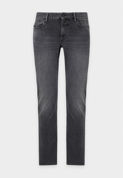 Jean slim gris foncé avec cinq poches et fermeture bouton et zip, présenté sur un fond clair uni.