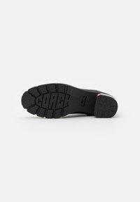 COACH Botines con plataforma - black
