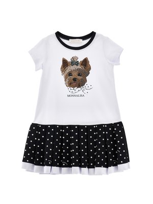 Biała sukienka z krótkim rękawem, czarnym kołnierzem, nadrukiem psiej twarzy z kokardą, napisem "MONNALISA" oraz czarną plisowaną spódnicą w białe kropki.