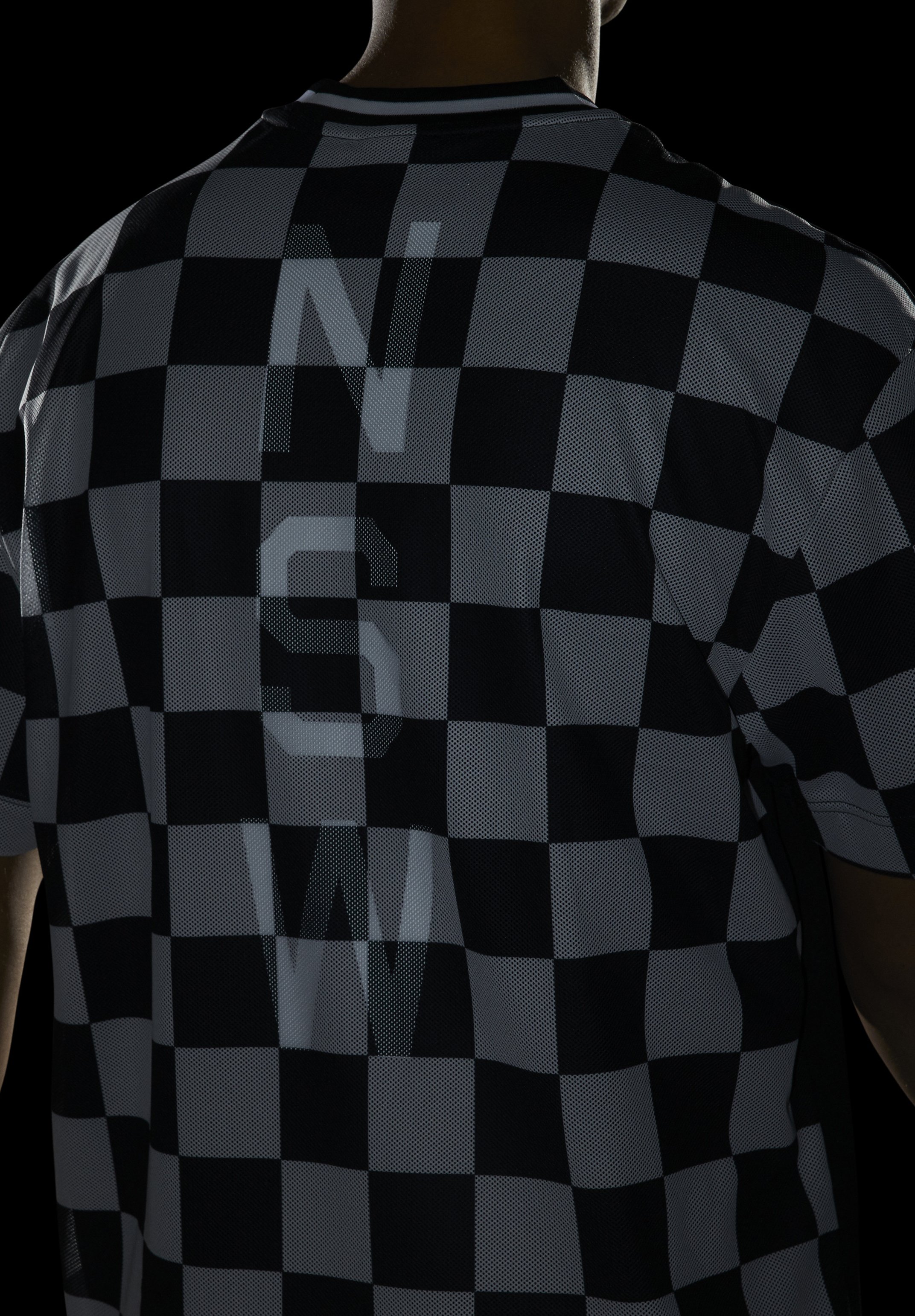 black nike shirt with white check