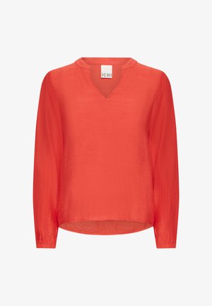 Blouse rouge à manches longues avec un col en V, faite d'un tissu léger et légèrement texturé, présentant une coupe décontractée et un ourlet arrondi.