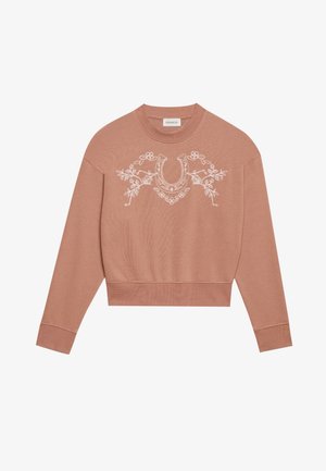 Sweatshirt rosa cortado com mangas longas, apresentando bordados florais brancos e um design de ferradura na parte da frente. Tecido suave e texturizado.