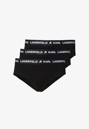Tre slip da uomo neri con fascia elastica bianca in vita, decorata con il testo "KARL LAGERFELD" e il logo in un motivo ripetuto.