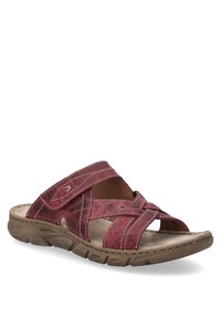 Red leather slide sandal featuring crossed straps and a cushioned footbed. Relaxed design with a textured sole for comfort.