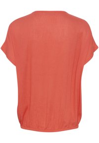 T-shirt à manches courtes en corail avec une coupe décontractée, une texture douce et un col rond avec un ourlet froncé.