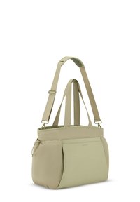 Torebka typu tote w jasnozielonym materiale, z regulowanymi paskami, dwiema kieszeniami bocznymi oraz gładkim, strukturalnym designem o minimalistycznym wyglądzie.