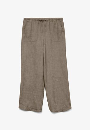 Beebitoonidega lõdvalt istuvad beežid püksid, millel on elastne vöökoht paelaga ja kaks eesmist taskut.