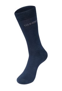 Calze blu navy realizzate in un tessuto morbido, con una parte superiore a costine e una texture liscia. Un logo è visibile vicino alla caviglia.