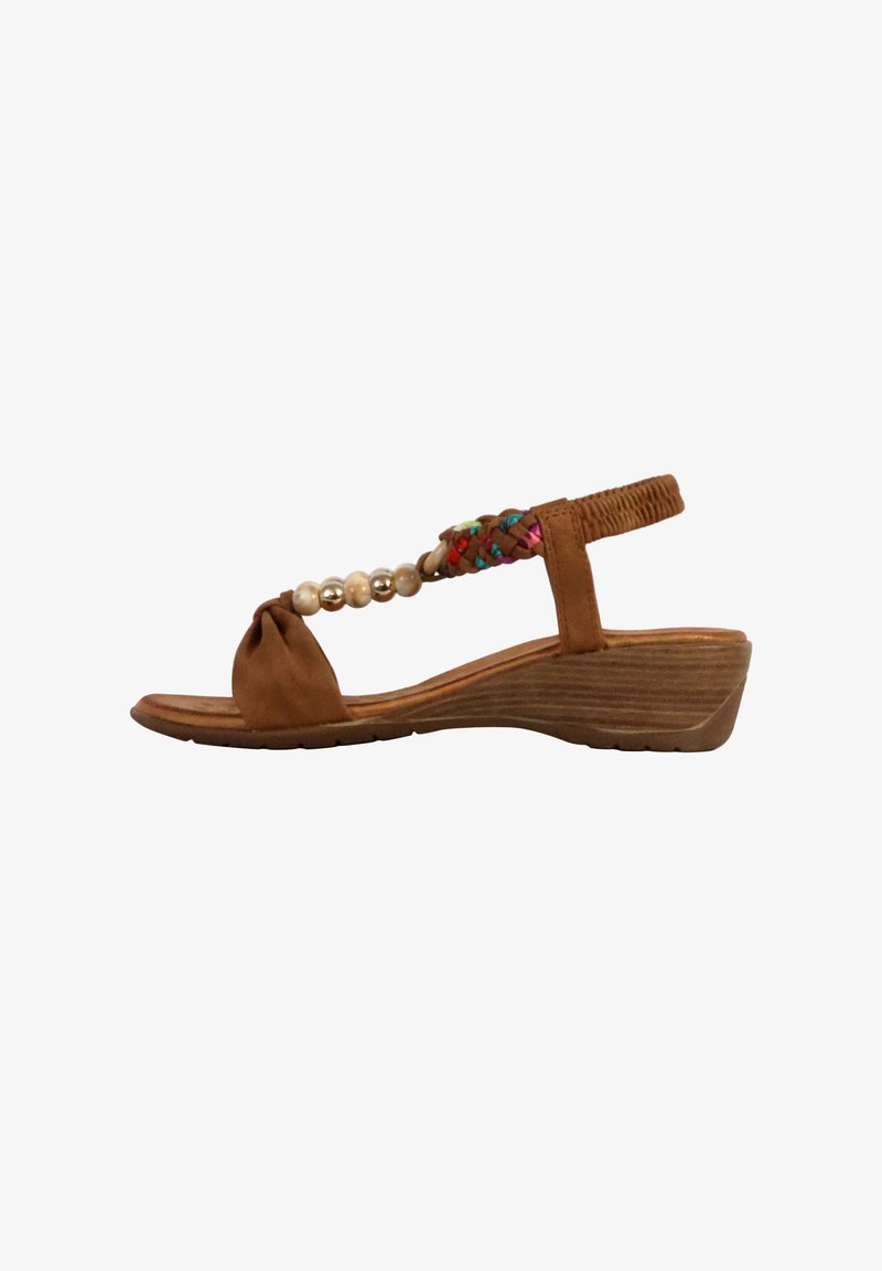 Brown leather wedge sandals with a knotted toe, beaded accents, and colorful braided strap. Textured sole for grip and stability.