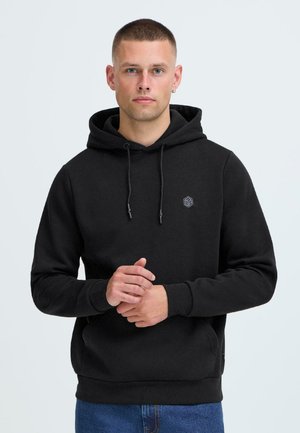 Black hooded sweatshirt with drawstrings, ribbed cuffs, and a small geometric logo on the chest. Soft texture and relaxed fit.