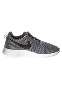 Black and gray mesh athletic shoe with a white sole, round toe, and black laces featuring a distinctive black Nike swoosh logo on the side.