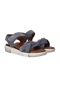 Blauwe suede sandalen met een crisscross ontwerp, verstelbare riemen en een bruine binnenzool. Witte rubberen zool met een gestructureerde afwerking.