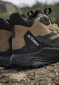 adidas Terrex ANYLANDER MID - Outdoorschoenen - cardboard/core black/shadow olive