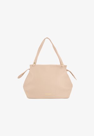 Large beige leather tote bag with dual short handles, snap closure, and embossed logo. Smooth texture and softly structured shape.