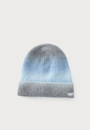Bonnet tricoté avec bord replié en dégradé gris et bleu clair, avec un petit logo "OBEY" brodé sur le bord.