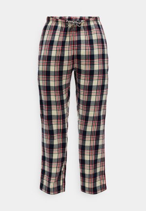 Pantaloni in flanella a quadri con vita elastica e cordoncino. I colori includono blu navy, crema e rosso in un motivo a quadri. Texture morbida.
