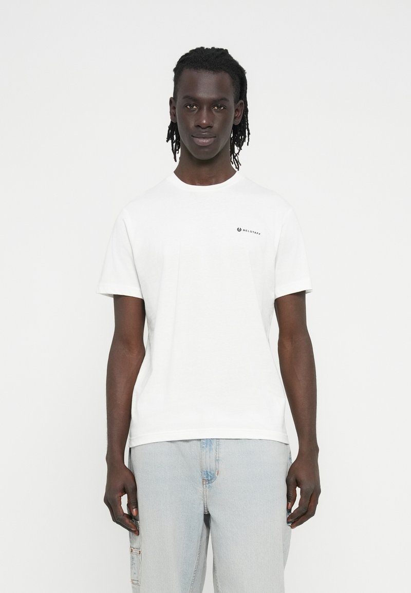 White cotton t-shirt with a crew neck, short sleeves, and a small black logo on the upper left chest. Smooth texture and relaxed fit.