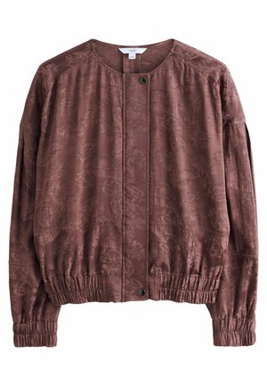 Hnědá bunda s květinovým vzorem vyrobená z lehkého materiálu. Má kulatý výstřih, elastické manžety a zapínání na přední knoflíky.