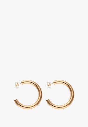 Goldfarbene Metall-Hoops mit einem dicken, geschwungenen Design und einer polierten Oberfläche. Mit einem Steckverschluss und einem sicheren Verschluss versehen.