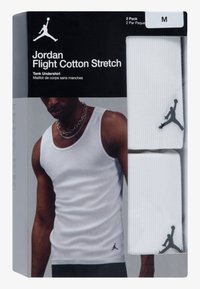 White cotton tank undershirt in a 2-pack. Features a round neckline and a small black Jordan logo on the bottom left side.